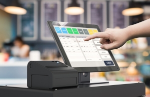 Employee using point of sale digital register